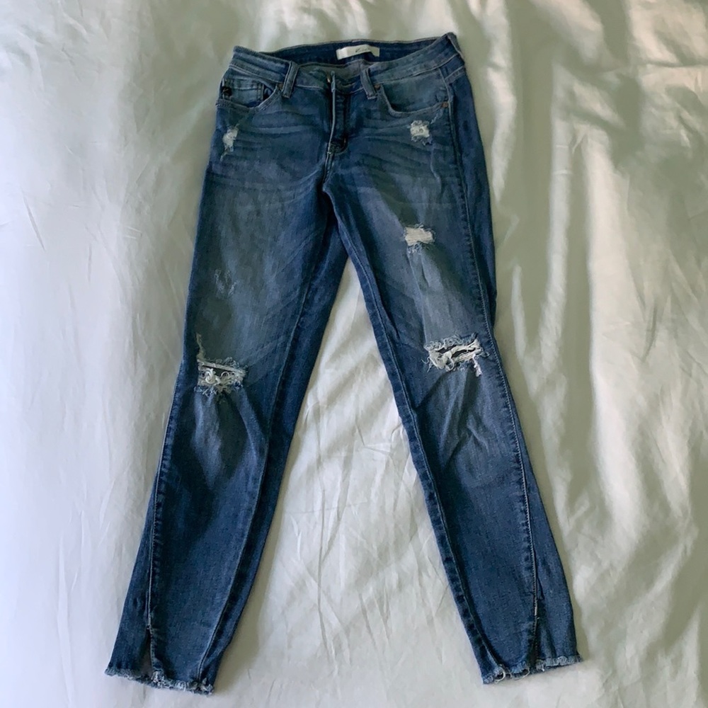 Ripped ankle skinny jeans with cut bottom